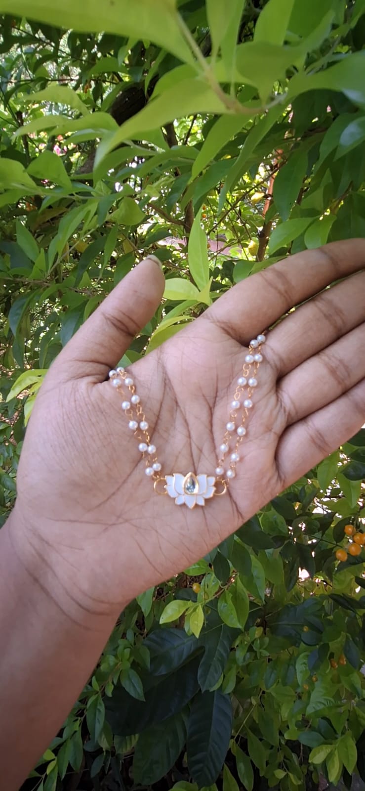 Pearl chain with Lotus charm